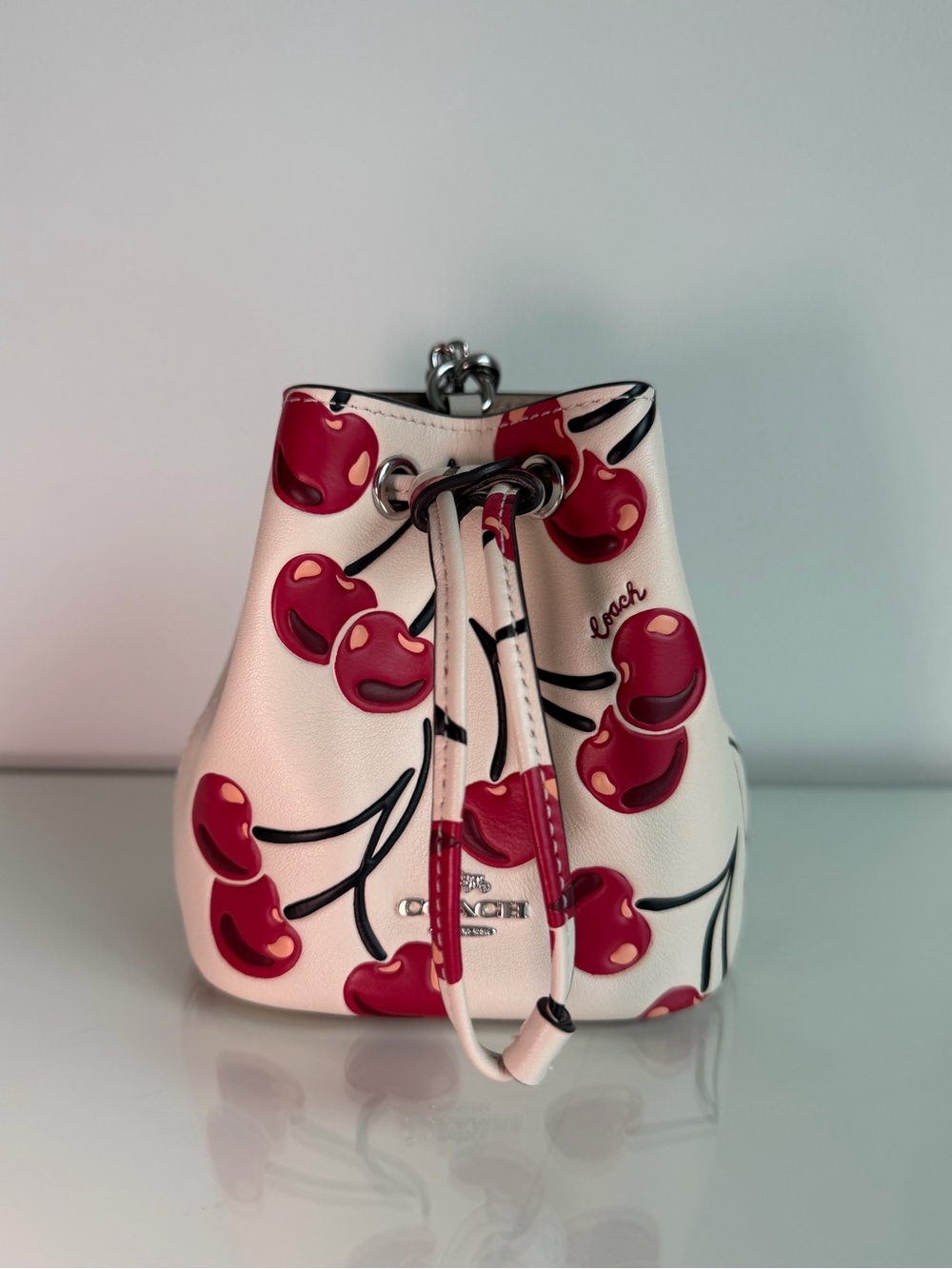 Coach White Leather Mini Drawstring Bag with Red Cherry Print